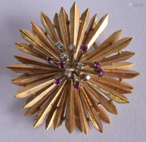 A 1970S 18CT GOLD SUNBURST DIAMOND AND RUBY BROOCH.