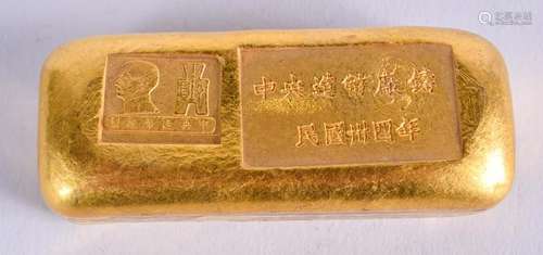 A CHINESE YELLOW METAL INGOT. 185 grams. 6 cm x 2.5 cm.