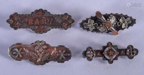 FOUR VINTAGE SILVER BROOCHES. (4)