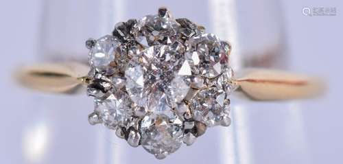 A 9CT GOLD AND DIAMOND CLUSTER RING. Size N. 2.8 grams.