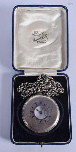 AN ANTIQUE SILVER POCKET WATCH with silver chain. 4.75