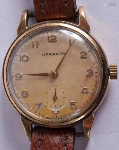 A VINTAGE 9CT GOLD GARRARD WRISTWATCH. 3 cm diameter.