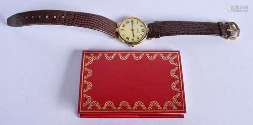 A CARTIER SILVER GILT WATCH. 2.75 cm wide.