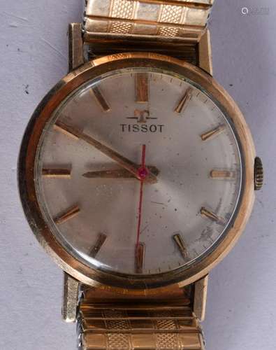 A VINTAGE 9CT GOLD TISSOT WRISTWATCH. 3.25 cm wide.