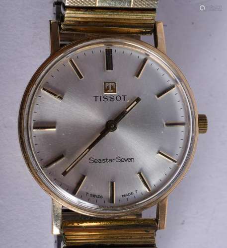 A 9CT GOLD SEASTAR SWAN TISSOT WRISTWATCH. 3.25 cm