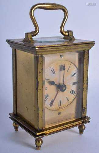 A BRASS CARRIAGE CLOCK. 15 cm high inc handle.