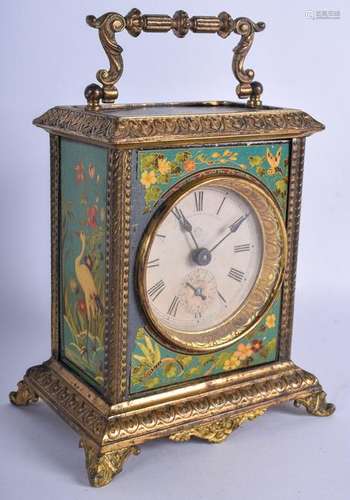 A VINTAGE LACQUERED TIN MANTEL CLOCK. 19 cm high inc