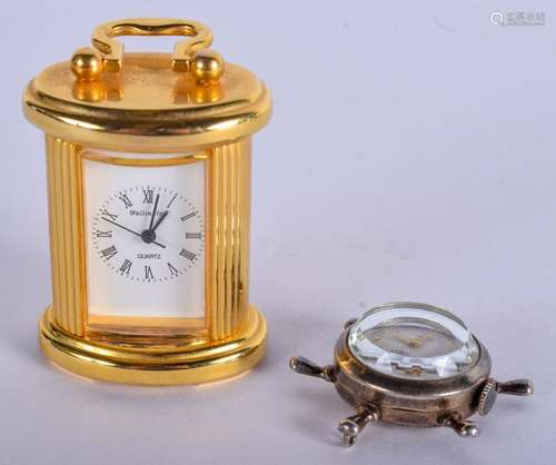 A WELLINGTON MINIATURE CARRIAGE CLOCK and a silver