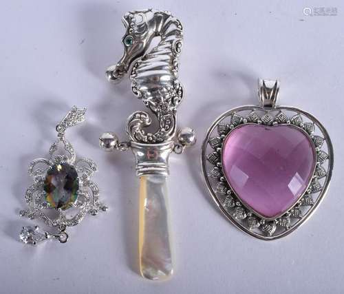 TWO SILVER PENDANTS and a silver seahorse rattle. (3)