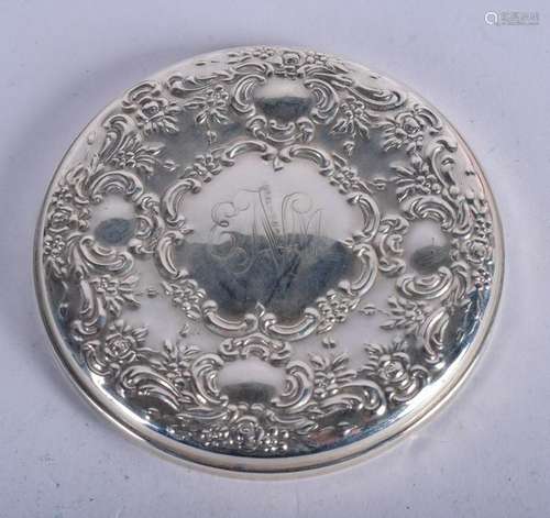 A SILVER MIRROR. 8 cm diameter.