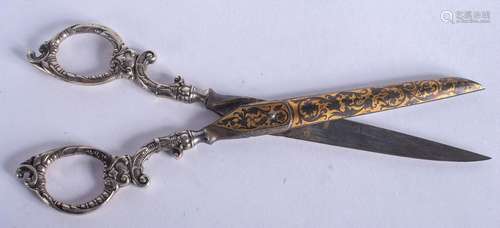 A PAIR OF ANTIQUE SILVER AND IRON SCISSORS. 16 cm long.