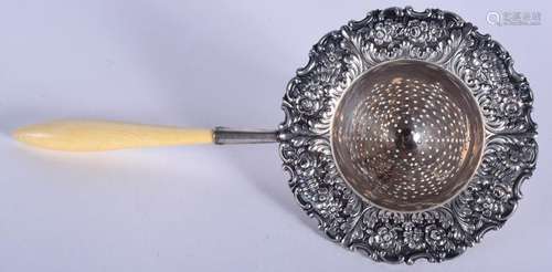 A VINTAGE TIFFANY & CO SILVER TEA STRAINER. 17 cm long.