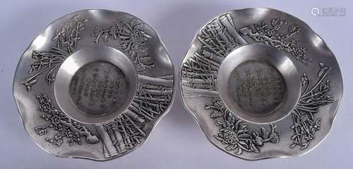 A PAIR OF SILVERED CHINESE DISHES. 11 cm wide.