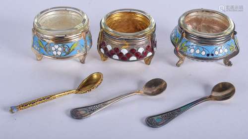 THREE CONTINENTAL ENAMELLED SALTS with spoons. (6)