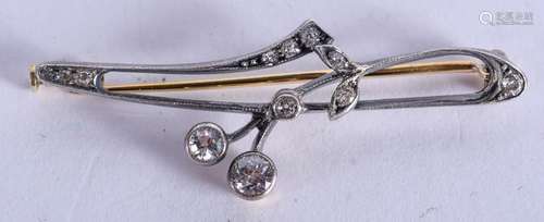 AN ART NOUVEAU GOLD DIAMOND AND SILVER BROOCH. 3.4