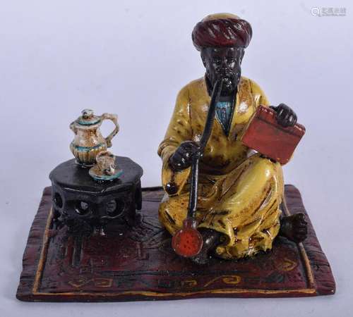 A COLD PAINTED BRONZE MALE modelled smoking a pipe. 8.5