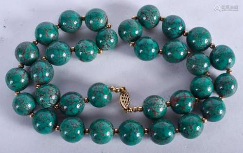 A TURQUOISE NECKLACE. 52 cm long.