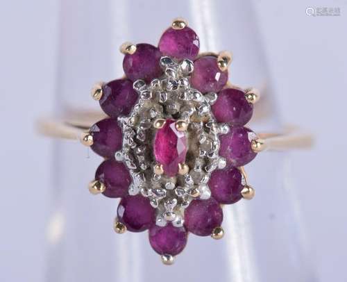 A 14CT GOLD RUBY AND DIAMOND RING. 3.5 grams. K/L.