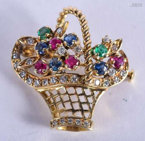 A 14CT GOLD SAPPHIRE DIAMOND RUBY AND EMERALD BROOCH.