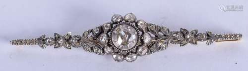 A VINTAGE GOLD SILVER AND ROSE CUT DIAMOND BROOCH. 9.5