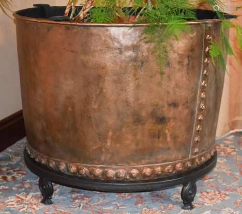 A HUGE COPPER PLANTER, formed with studwork banding. 62