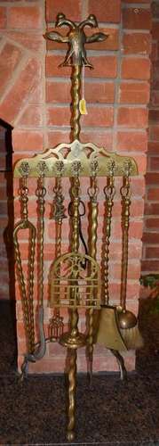 AN ANTIQUE FIREGUARD WITH ASSOCIATED HANGING TOOLS,