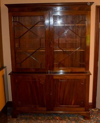 A LARGE MAHOGANY DISPLAY CABINET, formed with glass