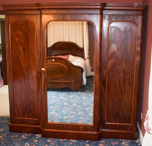 A VICTORIAN FLAME MAHOGANY COMPACTUM, formed with large