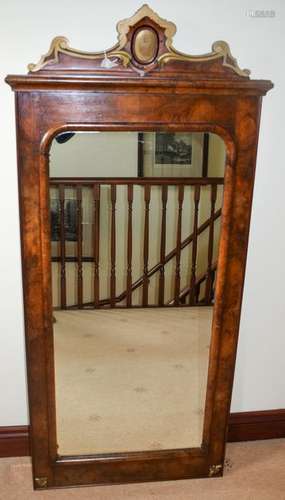 A GEORGE III FLAME MAHOGANY MIRROR, formed with a