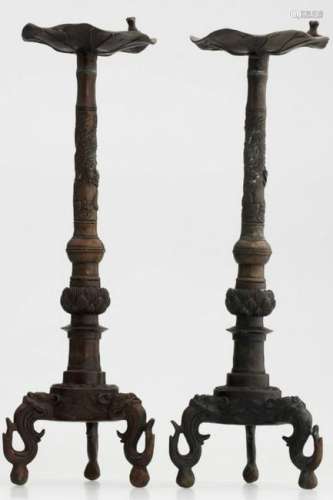 A pair of Chinese copper candle holders