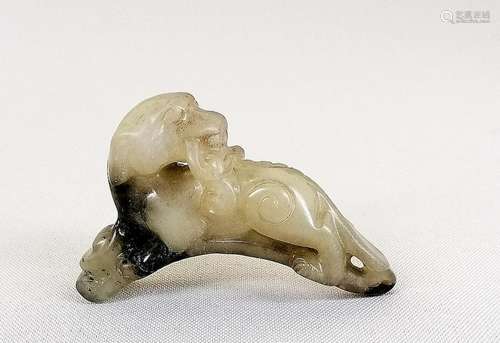 A Chinese carved jade lion