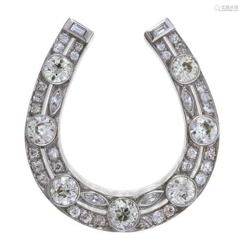 A platinum and diamond brooch,