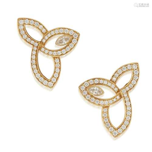 A pair of eighteen karat gold and diamond earrings,