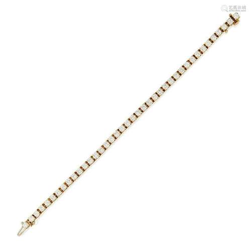 A fourteen karat gold and diamond line bracelet,