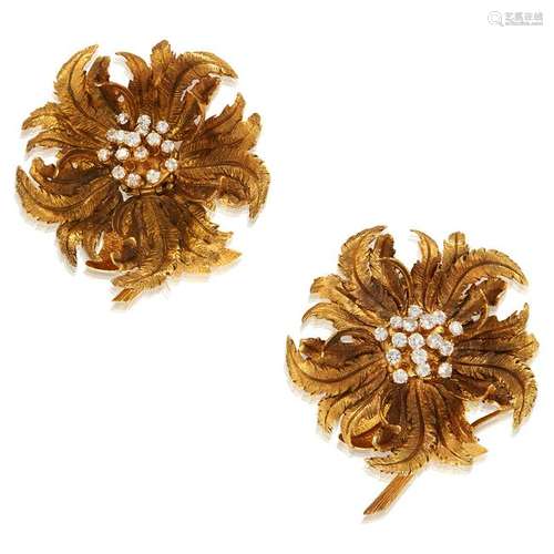 A pair of fourteen karat gold and diamond brooches,