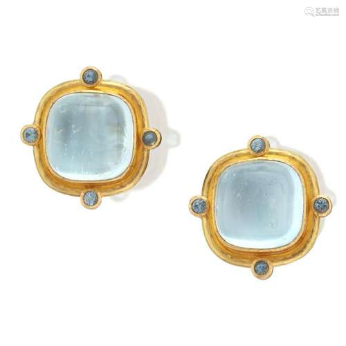 A pair of blue topaz and nineteen karat gold earrings,