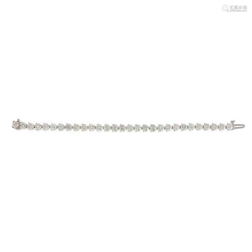 A diamond and eighteen karat white gold bracelet,