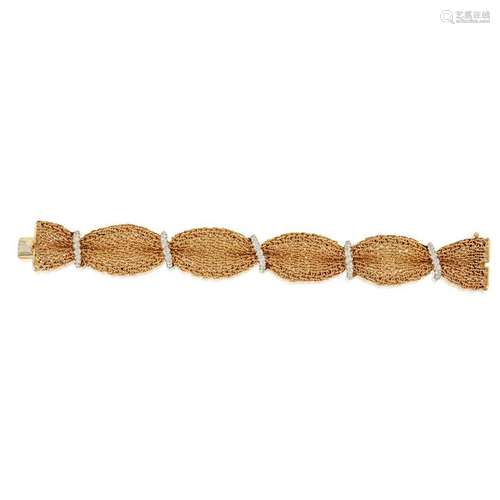 A two-tone fourteen karat gold and diamond bracelet,