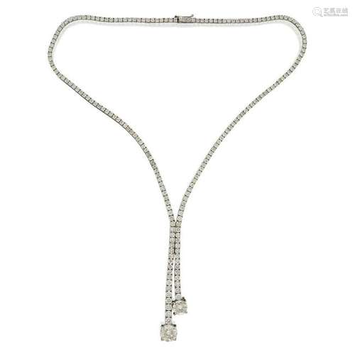 A diamond and eighteen karat white gold lariat