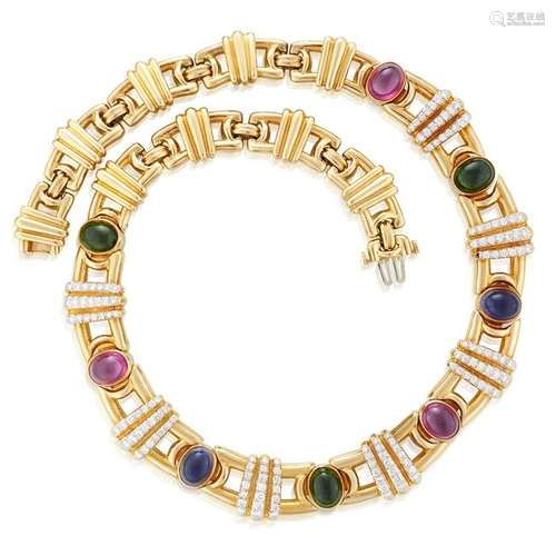 An eighteen karat gold, diamond, and cabochon gem-set