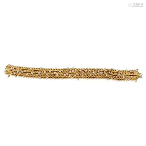 An eighteen karat gold and diamond bracelet,