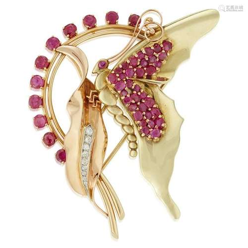 A fourteen karat two-tone gold and ruby brooch,