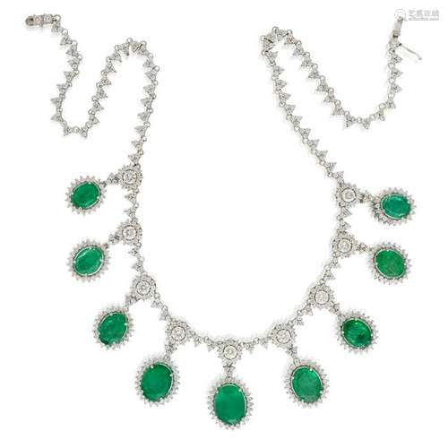 An emerald, diamond, and eighteen karat white gold