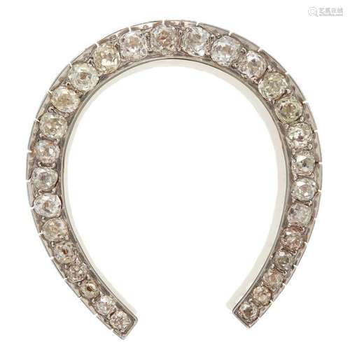 A diamond and eighteen karat gold brooch,