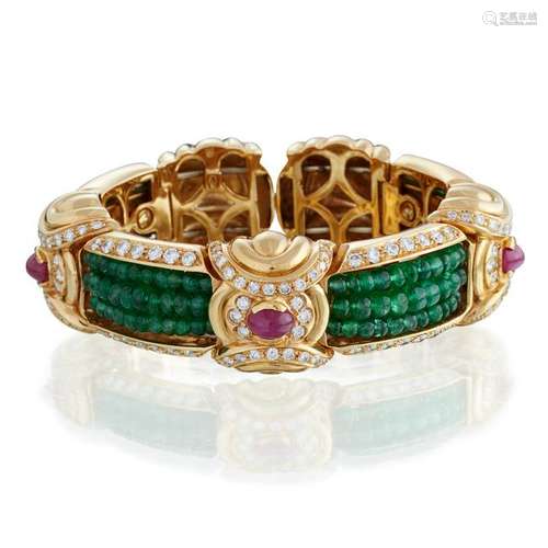 An eighteen karat gold, emerald, ruby, and diamond