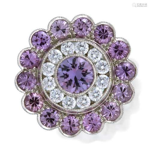 A purple sapphire, diamond, and platinum ring,