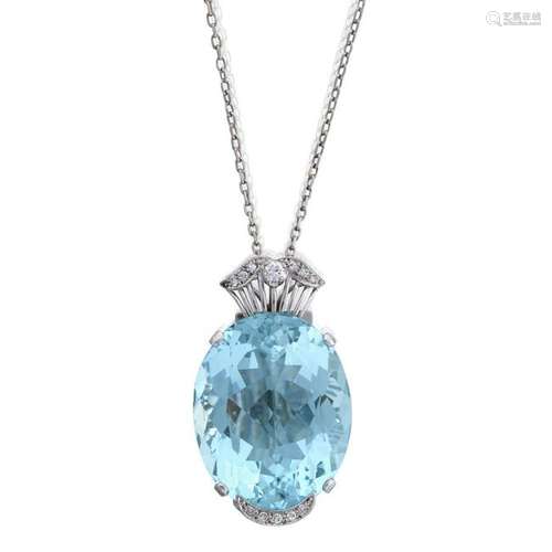 An aquamarine, diamond, and eighteen karat white gold