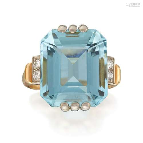 A two-tone fourteen karat gold, aquamarine, and diamond