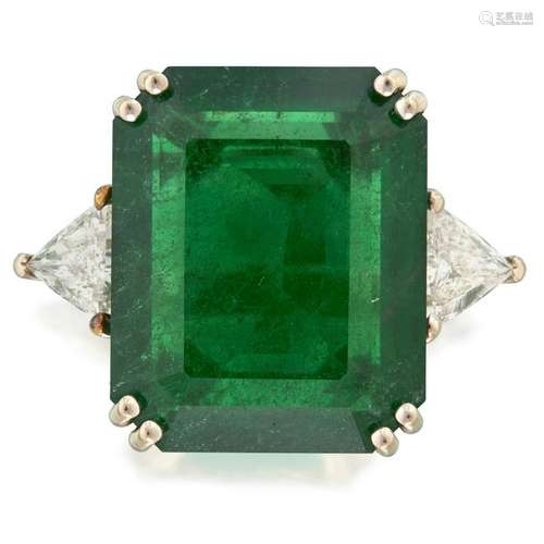 An emerald, diamond, and fourteen karat white gold