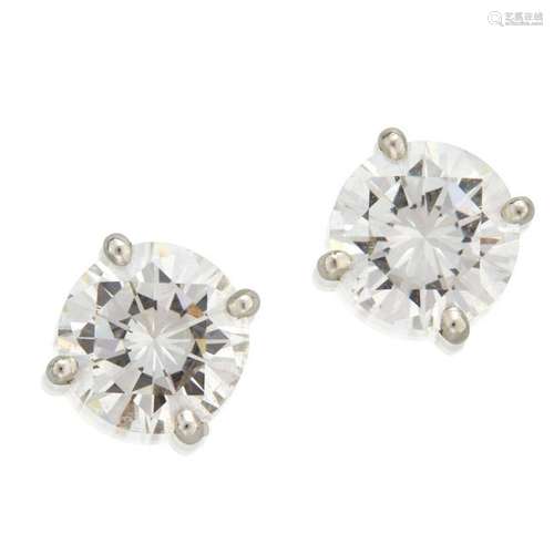 A pair of diamond and fourteen karat gold earrings,